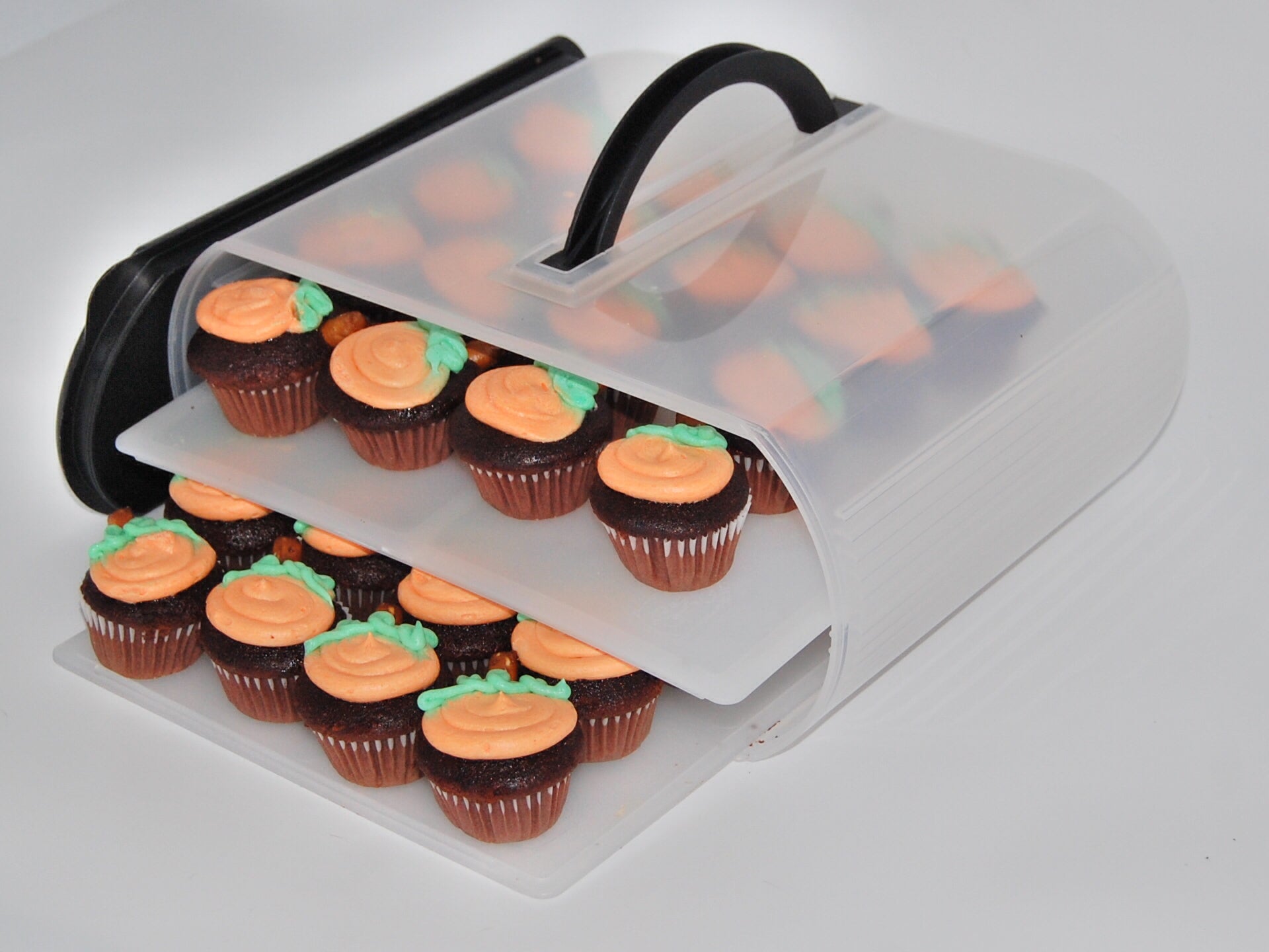 Bakers Sto N Go cookie carrier makes the perfect cupcake carrier too.  Bakers Sto N Go cookie carrier will hold up to 32 mini cupcakes and 12 large cupcakes.  Made in USA.  Women Owned.